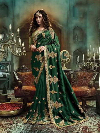 Adorn The Pretty Angelic Look Wearing This Heavy Designer Saree In Heavy Embroidery & Diamond Work In Fancy Color Paired With Contrasting Embroided Blouse. This Saree Is Fabricated On Art Silk Paired With Art Silk Fabricated Blouse. Its Pretty Color Pallete Will Give An Attractive Look To Your Personality. 