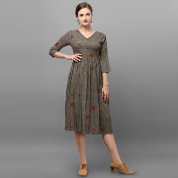 Grab This Readymade Long Kurti In Fine Color Fabricated On Rayon Beautified With Foil Prints. It Is Light In Weight And Easy To Carry All Day Long. 