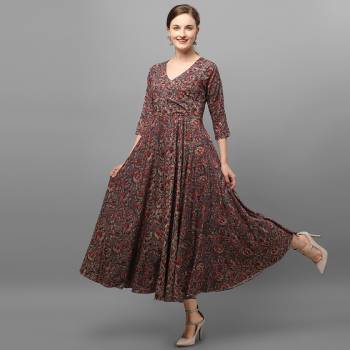 Grab This Readymade Long Kurti In Fine Color Fabricated On Rayon Beautified With Stylist Prints. It Is Light In Weight And Easy To Carry All Day Long. 