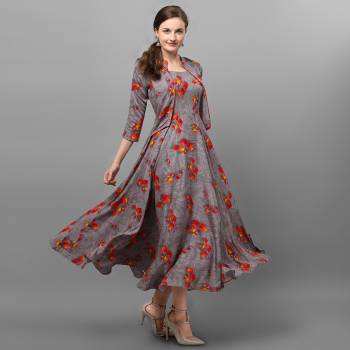 Grab This Readymade Long Kurti In Fine Color Fabricated On Rayon Beautified With Stylist Prints. It Is Light In Weight And Easy To Carry All Day Long. 