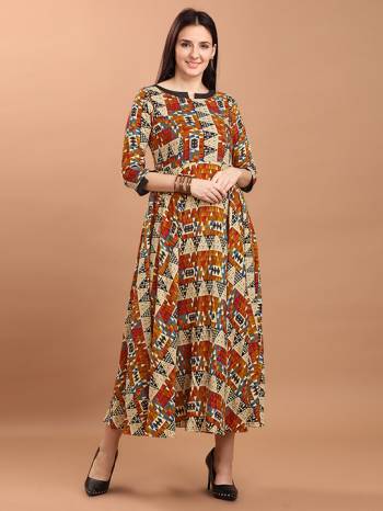 Grab This Readymade Long Kurti In Fine Color Fabricated On Rayon Beautified With Stylist Prints. It Is Light In Weight And Easy To Carry All Day Long. 