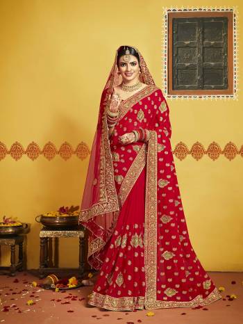 Grab This Pretty Elegant Looking Designer Saree In Red Color Paired With Contrasting Red Colored Blouse. This Saree And Blouse Are Silk Based Beautified With Heavy Jari Embroidery & Embroidery Border. Buy Now.