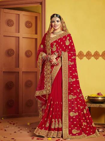 Grab This Pretty Elegant Looking Designer Saree In Red Color Paired With Contrasting Red Colored Blouse. This Saree And Blouse Are Silk Based Beautified With Heavy Jari Embroidery & Embroidery Border. Buy Now.