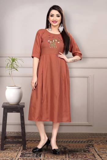 Grab This Readymade Long Kurti In Fine Color Fabricated On Pure Ruby Slub Cotton Beautified With Neck Embroidery Work. It Is Light In Weight And Easy To Carry All Day Long. 