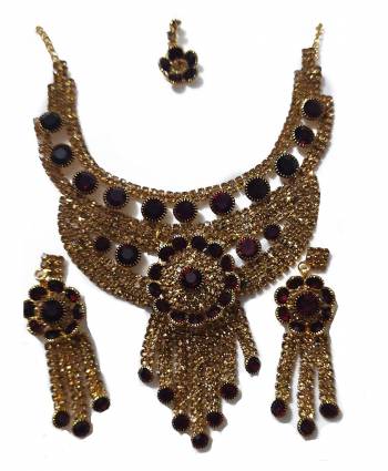 Give An Enhanced Look To Your Personality By Pairing Up This Beautiful Necklace Set With Your Ethnic Attire. This Pretty Set Is In Golden Color Beautified With Stone Work. Buy Now.