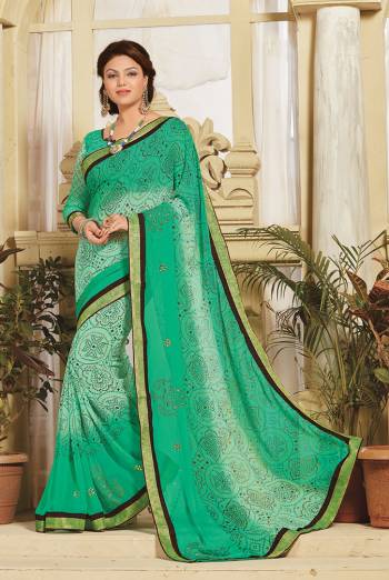 Look Attractive Wearing This Fine Colored Saree Paired With Canected Colored Blouse With Lace Border.  This Heavy Designer Saree Is Georgette Based Which Gives A Rich Look To Your Personality. Buy This Pretty Saree Now.