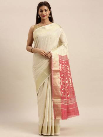 Look Attractive Wearing This White Colored Saree Paired With Pink Base Colored Blouse.  This Heavy Designer Saree Is Cotton Based Wevon Design Which Gives A Rich Look To Your Personality. Buy This Pretty Saree Now.