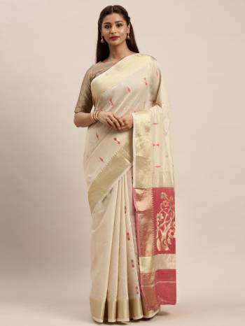 Look Attractive Wearing This White Colored Saree Paired With Pink Base Colored Blouse.  This Heavy Designer Saree Is Cotton Based Wevon Design Which Gives A Rich Look To Your Personality. Buy This Pretty Saree Now.