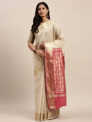 Look Attractive Wearing This White Colored Saree Paired With Pink Base Colored Blouse.  This Heavy Designer Saree Is Cotton Based Wevon Design Which Gives A Rich Look To Your Personality. Buy This Pretty Saree Now.