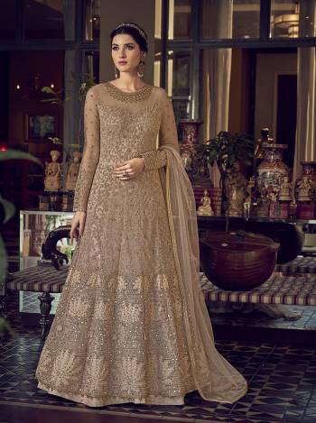 Grab This Pretty Designer Suit In Light Base Color For The Upcoming Festive And Wedding Season. Its Top Is Butterfly Nett Based Paired With Are Silk Bottom And Butterfly Nett Fabricated Dupatta. It Is Beautified With Designer Heavy Embroidery And Stone Work. Buy Now. 

