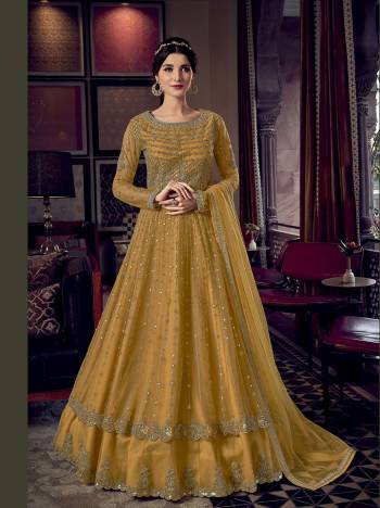 Grab This Pretty Designer Suit In Light Base Color For The Upcoming Festive And Wedding Season. Its Top Is Butterfly Nett Based Paired With Are Silk Bottom And Butterfly Nett Fabricated Dupatta. It Is Beautified With Designer Heavy Embroidery And Stone Work. Buy Now. 

