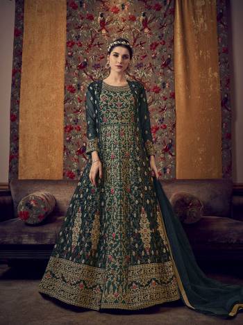 Grab This Pretty Designer Suit In Light Base Color For The Upcoming Festive And Wedding Season. Its Top Is Butterfly Nett Based Paired With Are Silk Bottom And Butterfly Nett Fabricated Dupatta. It Is Beautified With Designer Heavy Embroidery And Stone Work. Buy Now. 

