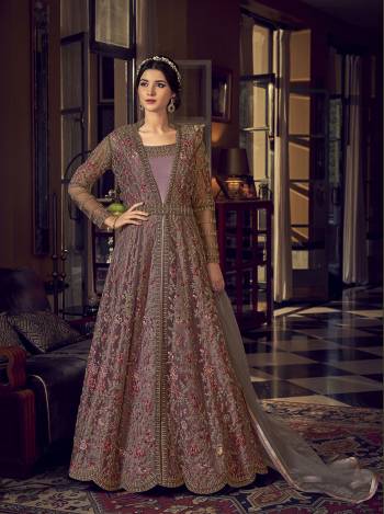 Grab This Pretty Designer Suit In Light Base Color For The Upcoming Festive And Wedding Season. Its Top Is Butterfly Nett Based Paired With Are Silk Bottom And Butterfly Nett Fabricated Dupatta. It Is Beautified With Designer Heavy Embroidery And Stone Work. Buy Now. 

