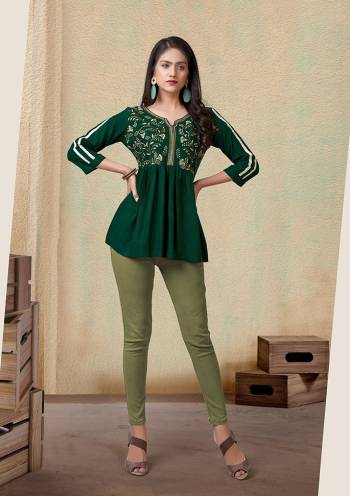 Grab This Readymade Short Kurti In Fine Color Fabricated On Rayon Beautified With Embroidery Work. It Is Light In Weight And Easy To Carry All Day Long. 