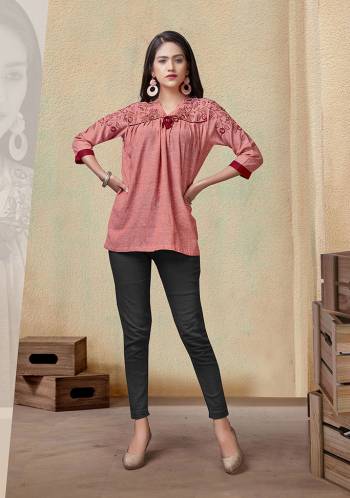 Grab This Readymade Short Kurti In Fine Color Fabricated On Rayon Beautified With Embroidery Work. It Is Light In Weight And Easy To Carry All Day Long. 