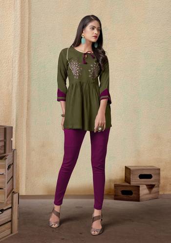 Grab This Readymade Short Kurti In Fine Color Fabricated On Rayon Beautified With Embroidery. It Is Light In Weight And Easy To Carry All Day Long. 