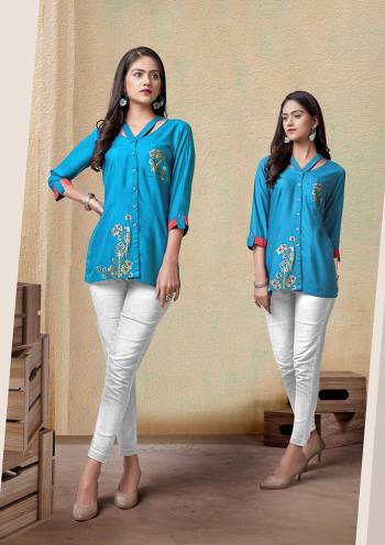 Grab This Readymade Short Kurti In Fine Color Fabricated On Rayon Beautified With Embroidery. It Is Light In Weight And Easy To Carry All Day Long. 