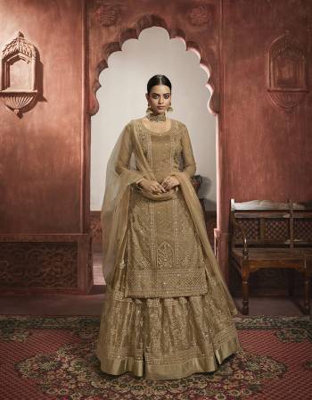 Beautiful looks in this Beige COLOR fabric Super net with inner  and GHARARA semi stiched type and bottom chudidar style suit with embroidered floral patterns on the yoke and sleeves. Comes with matching net dupatta