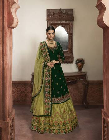 Beautiful looks in this Green COLOR fabric faux georgette with inner  and GHARARA semi stiched type and bottom chudidar style suit with embroidered floral patterns on the yoke and sleeves. Comes with matching net dupatta