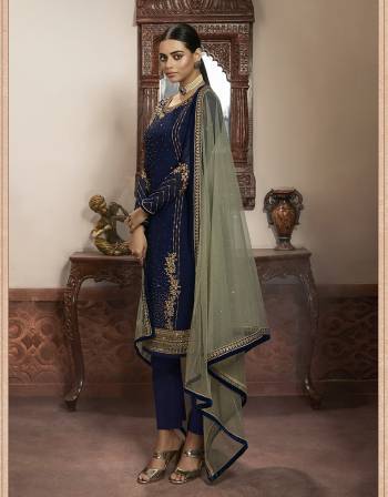 Beautiful looks in this Nevy blue COLOR fabric faux georgette with inner  and GHARARA semi stiched type and bottom chudidar style suit with embroidered floral patterns on the yoke and sleeves. Comes with matching net dupatta