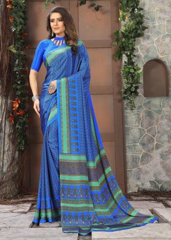 Celebrate This Festive Season In This Very Nyce Colored Saree Paired with Maching Blouse. This Saree and Blouse Are Crepe Silk Based Beautified With Detailed Fancy Print Saree. 