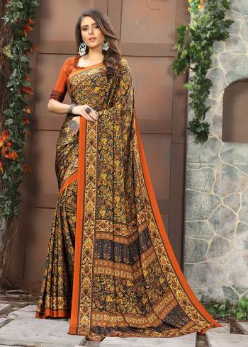 Celebrate This Festive Season In This Very Nyce Colored Saree Paired with Maching Blouse. This Saree and Blouse Are Crepe Silk Based Beautified With Detailed Fancy Print Saree. 