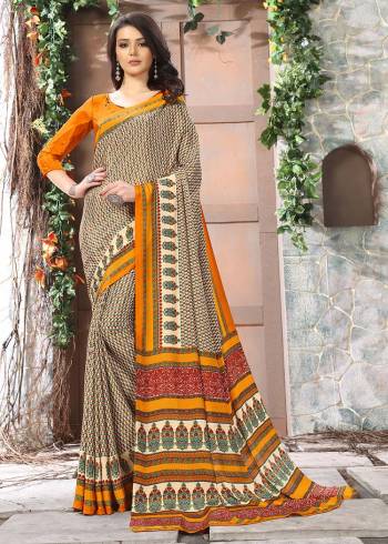 Celebrate This Festive Season In This Very Nyce Colored Saree Paired with Maching Blouse. This Saree and Blouse Are Crepe Silk Based Beautified With Detailed Fancy Print Saree. 