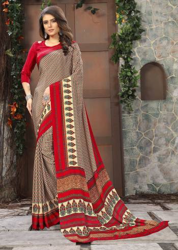 Celebrate This Festive Season In This Very Nyce Colored Saree Paired with Maching Blouse. This Saree and Blouse Are Crepe Silk Based Beautified With Detailed Fancy Print Saree. 