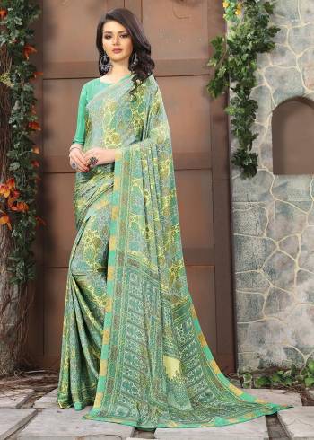 Celebrate This Festive Season In This Very Nyce Colored Saree Paired with Maching Blouse. This Saree and Blouse Are Crepe Silk Based Beautified With Detailed Fancy Print Saree. 