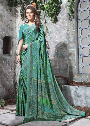 Celebrate This Festive Season In This Very Nyce Colored Saree Paired with Maching Blouse. This Saree and Blouse Are Crepe Silk Based Beautified With Detailed Fancy Print Saree. 