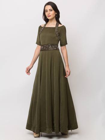 This Floor Length Green Gown is crafted in Cotton, features a  Short Sleeves and  round_neck ,embellishments all over, a zip closure on the side and a regular fit. Style this gown with matching jewellery and pair it with heels to make a statement look.