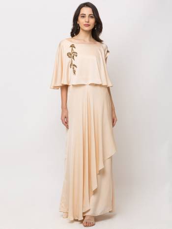 This Floor Length Cream Gown   is crafted in Cotton , features a  Short Sleeves and  round_neck ,embellishments all over, a zip closure on the side and a regular fit. Style this gown with matching jewellery and pair it with heels to make a statement look.