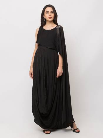 This Floor Length Black Gown   is crafted in SOFT Lycra , features a  Short Sleeves and  round_neck ,embellishments all over, a zip closure on the side and a regular fit. Style this gown with matching jewellery and pair it with heels to make a statement look.