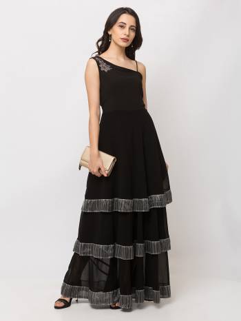 This Floor Length Black Gown is crafted in Georgette, features a  Sleeveless  and  single shoulder neck ,embellishments all over, a zip closure on the side and a regular fit. Style this gown with matching jewellery and pair it with heels to make a statement look.