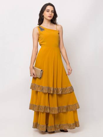 This Floor Length Mustard Gown  is crafted in Georgette, features a Sleeveless and  single shoulder neck  ,embellishments all over, a zip closure on the side and a regular fit. Style this gown with matching jewellery and pair it with heels to make a statement look.