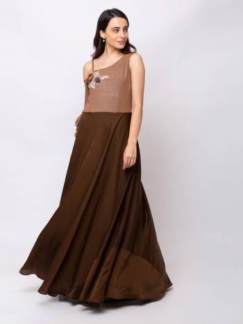 This Floor Length Choclate Brown Gown  is crafted in Crepe , features a One side sleeve and  Single shoulder_neck ,embellishments all over, a zip closure on the side and a regular fit. Style this gown with matching jewellery and pair it with heels to make a statement look.