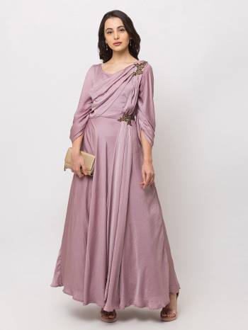 This Floor Length Pink Gown   is crafted in Crepe , features a  Short Sleeves and  round_neck ,embellishments all over, a zip closure on the side and a regular fit. Style this gown with matching jewellery and pair it with heels to make a statement look.