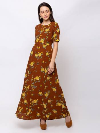 This Brown maxi is crafted in Crepe features a Short Sleeves and round ,embellishments all over, a zip closure on the side and a regular fit. Style This gown with matching jewellery and pair it with heels to make a statement look.