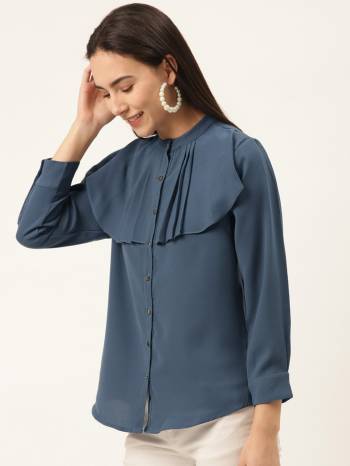 This Ocean Blue Top Is Crafted In Georgette WithSolid Pattern Featuring A mandrain neck full sleeves with pleated cowl.This Top offers a comfortable fit. Style this Top with a matching  Jeans and a pair your regular sneakers to attain a casual look.