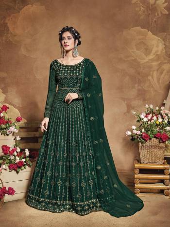 Flaunt Your Rich And Elegant Taste Wearing This Heavy Designer Floor Length Suit In Fine Color. Its Floor Length Top Is Butterfly Net Based Beautified With Attractive Contrasting Embroidery Paired With Silk Base Bottom And Butterfly Net Fabricated Dupatta. Buy Now.

