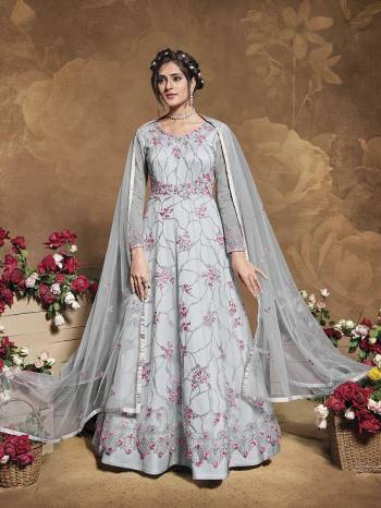 Flaunt Your Rich And Elegant Taste Wearing This Heavy Designer Floor Length Suit In Fine Color. Its Floor Length Top Is Butterfly Net Based Beautified With Attractive Contrasting Embroidery Paired With Silk Base Bottom And Butterfly Net Fabricated Dupatta. Buy Now.

