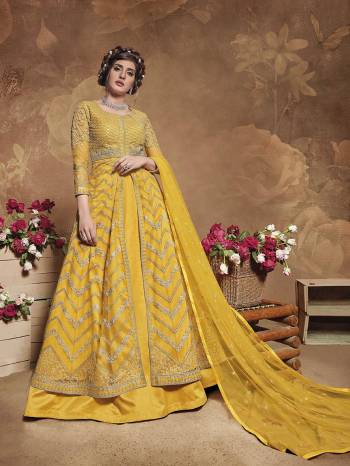 Flaunt Your Rich And Elegant Taste Wearing This Heavy Designer Floor Length Suit In Fine Color. Its Floor Length Top Is Butterfly Net Based Beautified With Attractive Contrasting Embroidery Paired With Silk Base Bottom And Butterfly Net Fabricated Dupatta. Buy Now.

