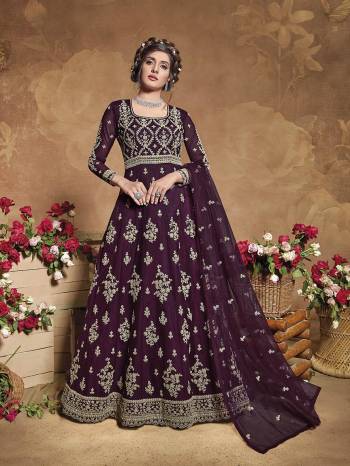 Flaunt Your Rich And Elegant Taste Wearing This Heavy Designer Floor Length Suit In Fine Color. Its Floor Length Top Is Butterfly Net Based Beautified With Attractive Contrasting Embroidery Paired With Silk Base Bottom And Butterfly Net Fabricated Dupatta. Buy Now.

