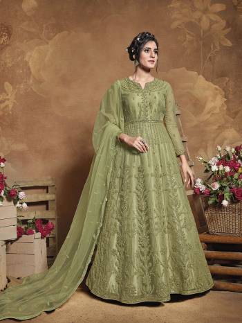 Flaunt Your Rich And Elegant Taste Wearing This Heavy Designer Floor Length Suit In Fine Color. Its Floor Length Top Is Butterfly Net Based Beautified With Attractive Contrasting Embroidery Paired With Silk Base Bottom And Butterfly Net Fabricated Dupatta. Buy Now.

