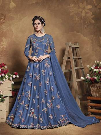 Flaunt Your Rich And Elegant Taste Wearing This Heavy Designer Floor Length Suit In Fine Color. Its Floor Length Top Is Butterfly Net Based Beautified With Attractive Contrasting Embroidery Paired With Silk Base Bottom And Butterfly Net Fabricated Dupatta. Buy Now.

