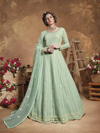 Flaunt Your Rich And Elegant Taste Wearing This Heavy Designer Floor Length Suit In Fine Color. Its Floor Length Top Is Butterfly Net Based Beautified With Attractive Contrasting Embroidery Paired With Silk Base Bottom And Butterfly Net Fabricated Dupatta. Buy Now.

