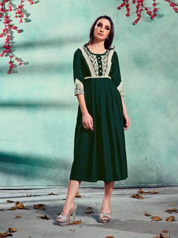 Grab This Readymade Long Kurti In Fine Color Fabricated On Rayon Beautified With Embroidery. It Is Light In Weight And Easy To Carry All Day Long. 