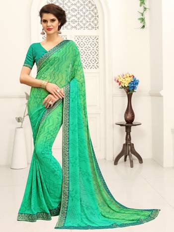 Look Attractive Wearing This Coloithred Saree Printed Paired With Blouse.  This Heavy Designer Saree Is Georgette Based & Benglori Silk Based Blouse With Lace Border Which Gives A Rich Look To Your Personality. Buy This Pretty Saree Now.