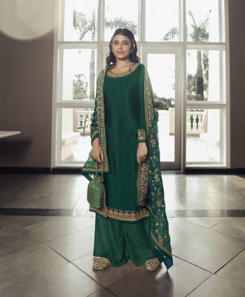 Flaunt Your Rich and Elegant Taste Wearing This Designer Heavy Straight Cut Suit In Dark Color. Its Lovely Heavy Embroidered Top Is Fabricated On Chinon Silk Paired With Santoon Bottom And Chinon Fabricated Dupatta With Lace Border Embroidery. Buy This Elegant Designer Piece Now. 