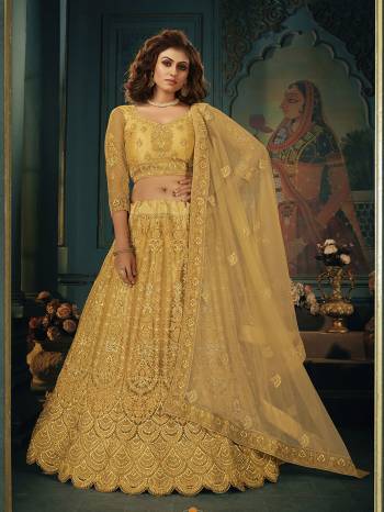 Heavy Designer Lehenga Choli & dupatta In Dark Fine Color Fabricated On Net Beautified With Heavy Attractive Embroidery. Wedding Special.